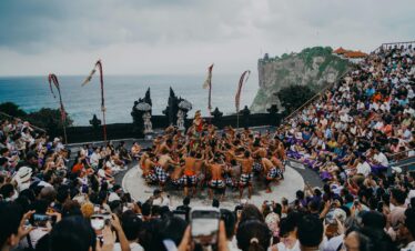 Bali's iconic Kecak dance performed at an open-air amphitheater overlooking the ocean.