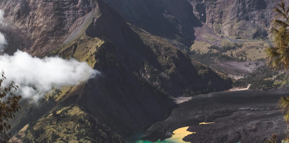 Majestic mountain with clear blue lake under a cloudless sky, perfect for nature lovers.